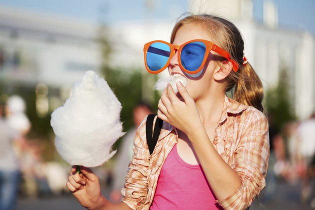 Girl eating cotton candy