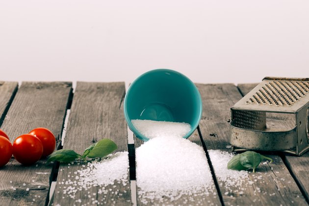 Spilled salt on a wooden table
