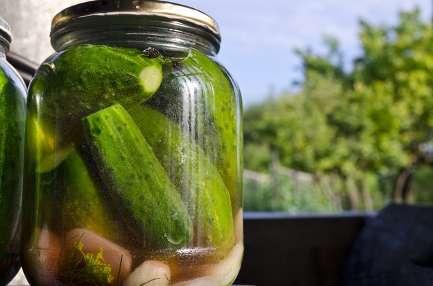 Pickled homemade cucumbers in the glass jar, preserved vegetables