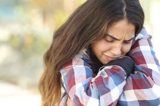 Teenager girl worried and sad outdoors
