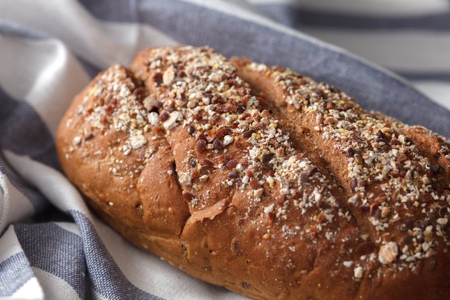 Dark multigrain bread whole grain fresh baked on rustic