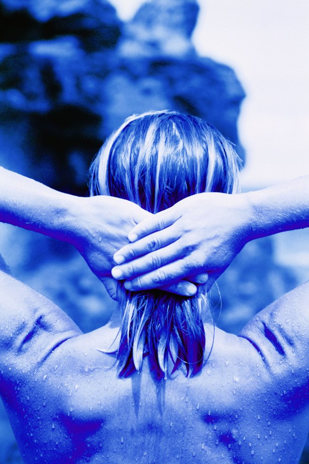 Woman with hands on hair