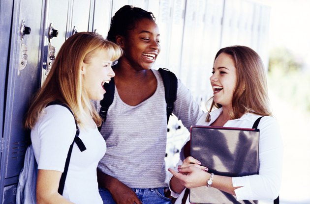 Teenage girls by lockers