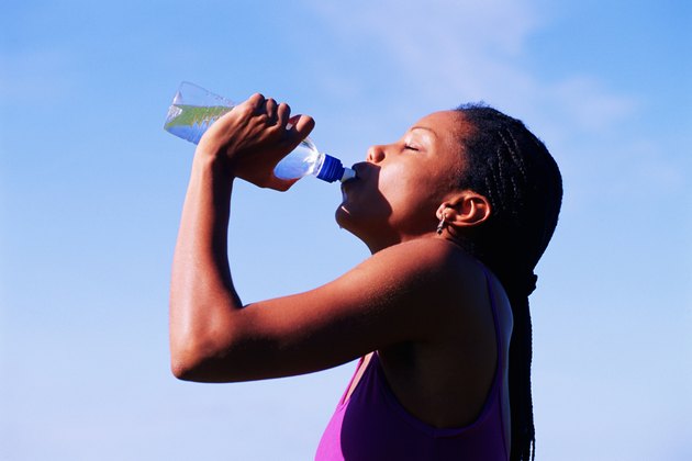 Side view of woman drinking water