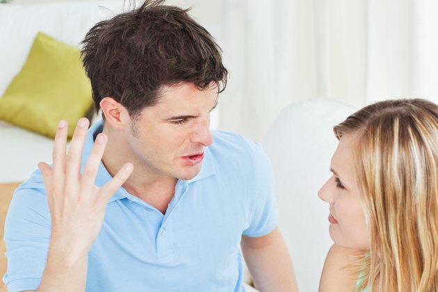 Furious young man working up against his girlfriend