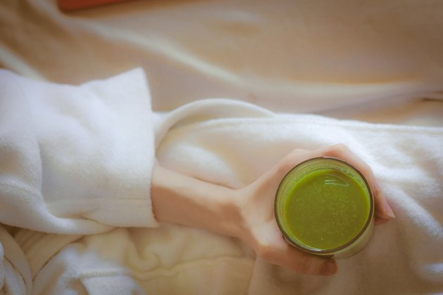 Ariel green smoothies on health spa white robe