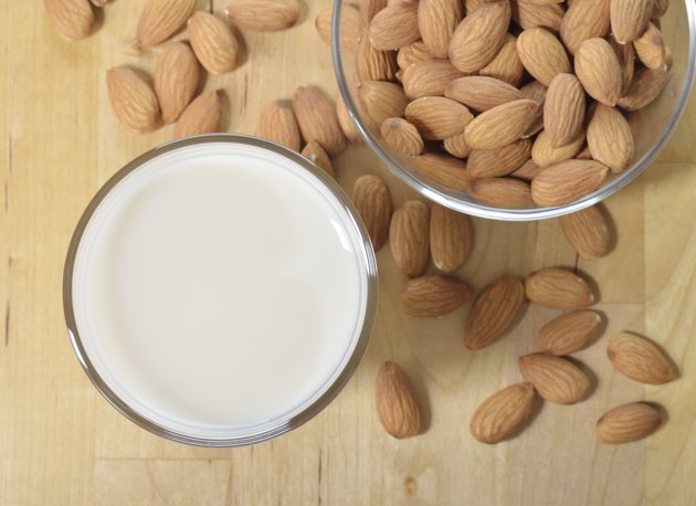 Glass of Almond milk on a table.