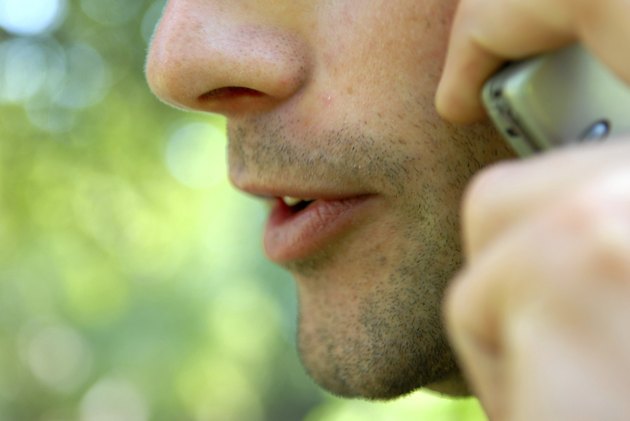 Close-up of a man talking on a mobile phone