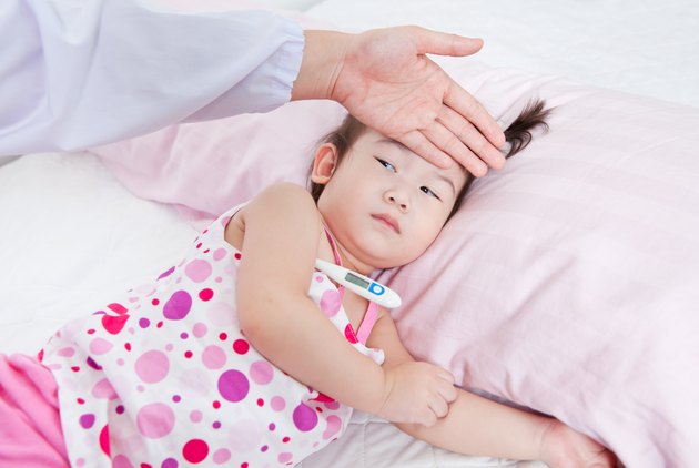 Sick little girl nursed by a pediatrician