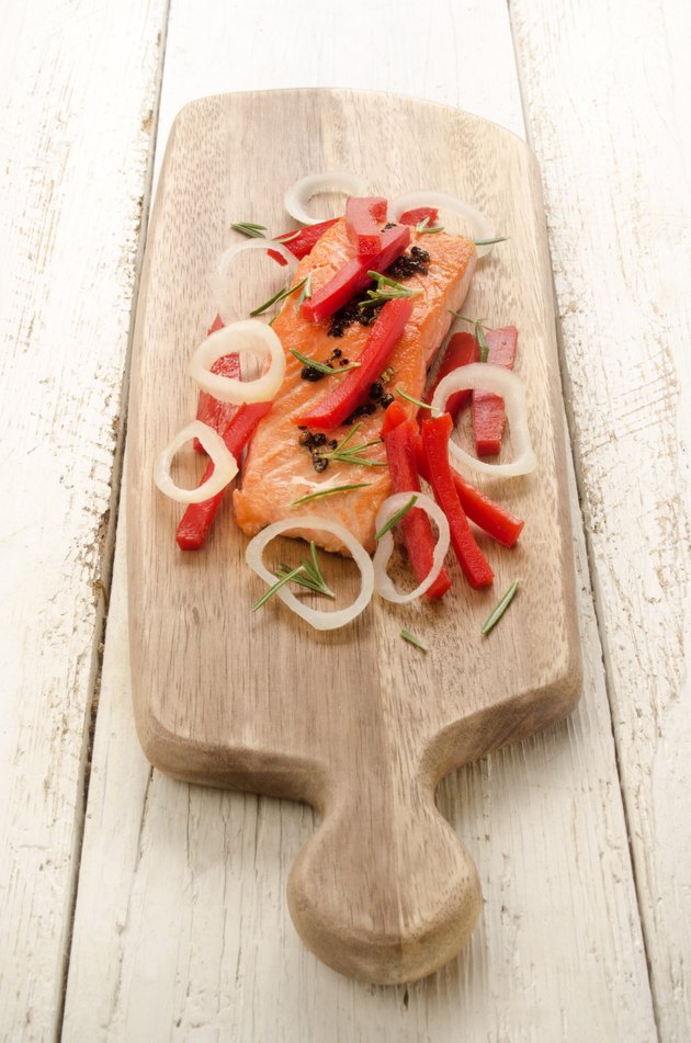 grilled salmon fillet on wooden board