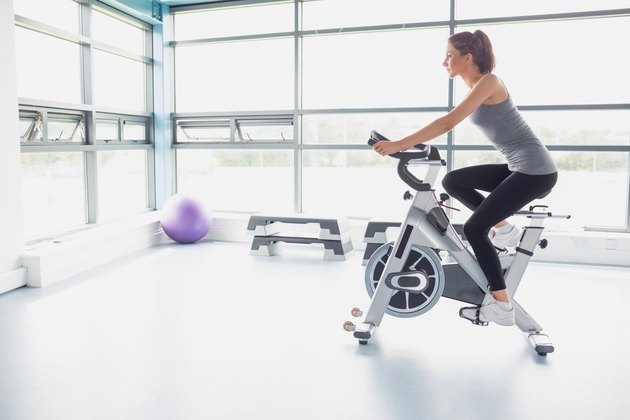 Woman riding an exercise bike