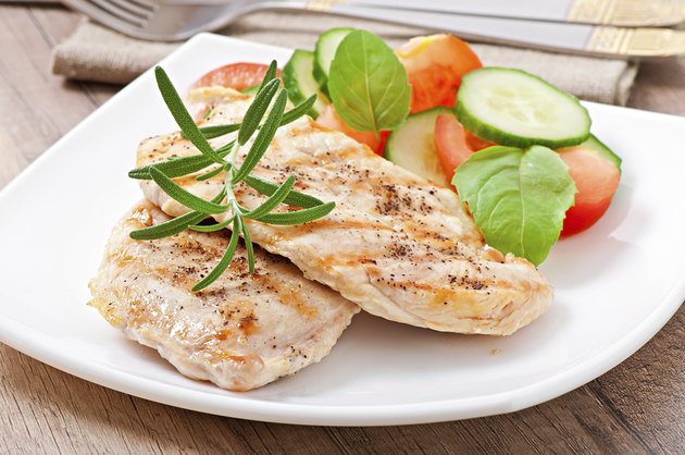 Grilled chicken breasts and vegetables