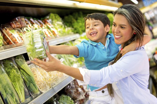 Woman at the supermarket with her son