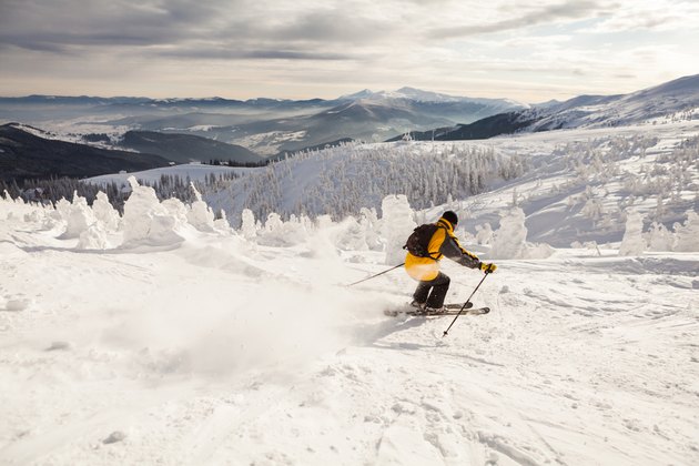 Man Snow Skiing Against Blue Sky