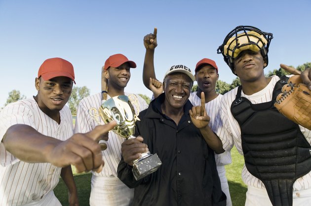 Baseball Team And Coach With Trophy Celebrating Victory