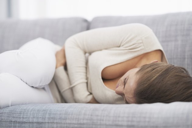 feeling bad young woman laying on sofa