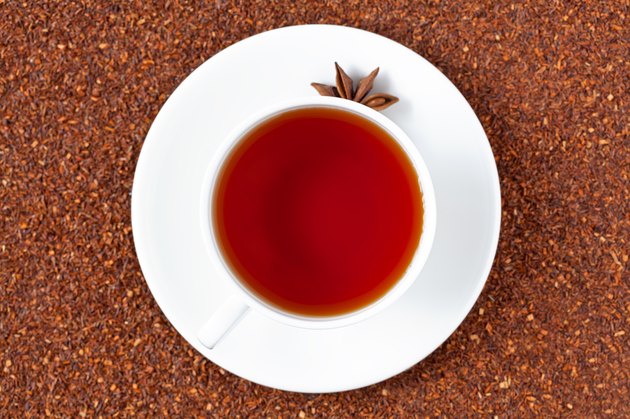 White cup of red rooibos South African tea with star