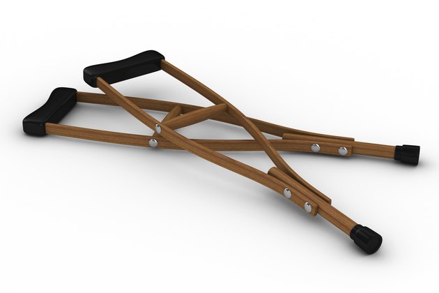 Crutches on white background. Isolated 3D image