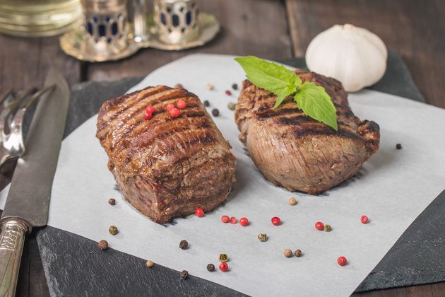 Grilled beef steak close up on paper