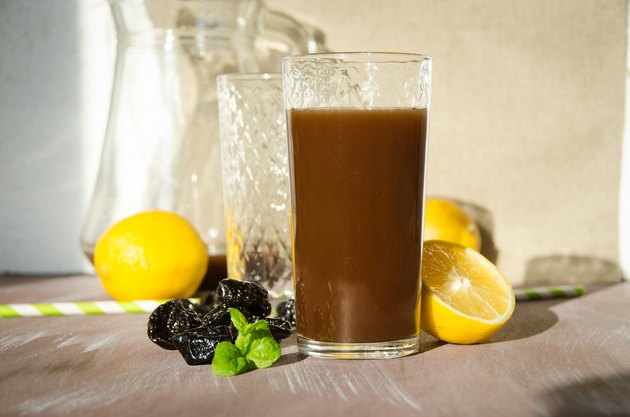 plum compote with lemon drinking glass