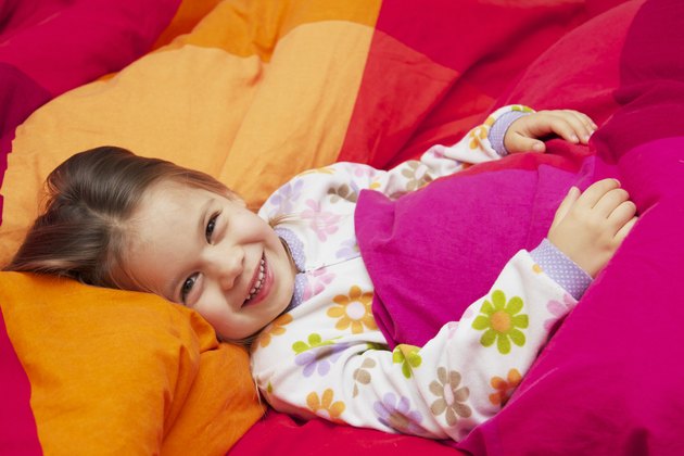 Little Girl on a Large Bed