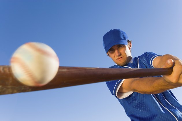 Batter Hitting Baseball