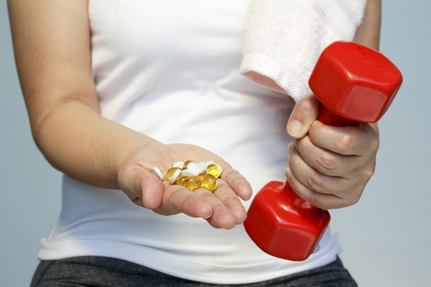 woman hand with vitamins and medication