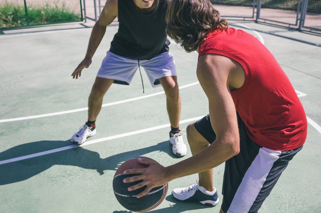 Men playing basketball