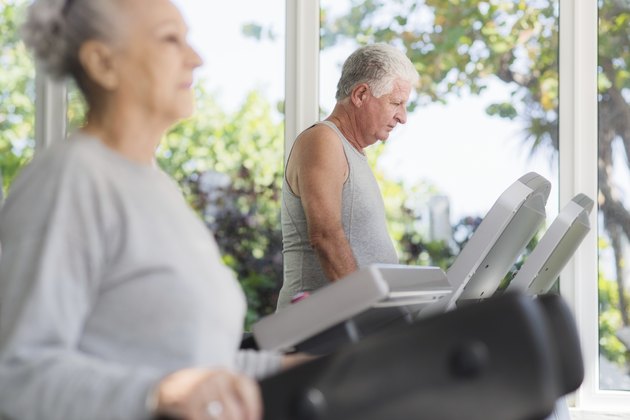senior man exercising in wellness club