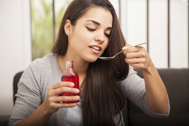 Drinking cough syrup at home