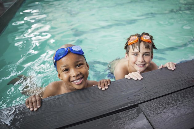 Little boys smiling in the pool