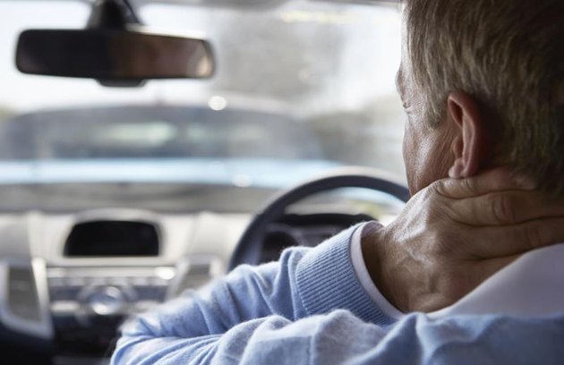 Driver Suffering From Whiplash After Traffic Collision