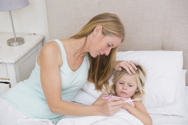 Cute sick girl being looked after