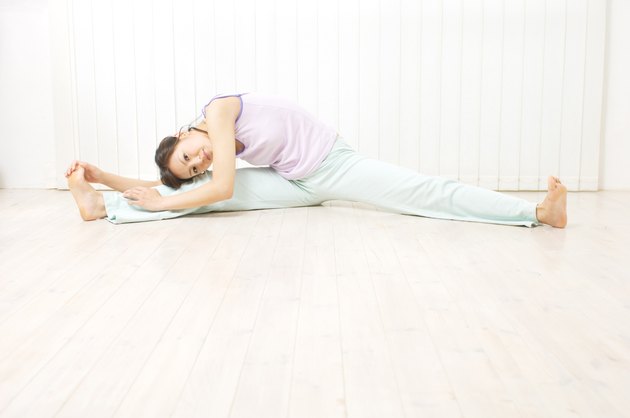 Young woman doing stretches