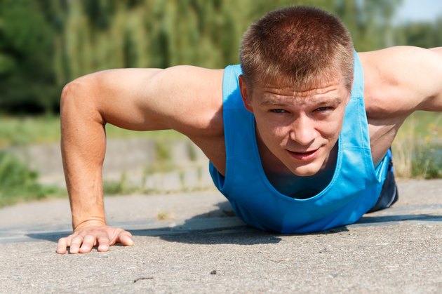 Man doing push-up while outdoor training