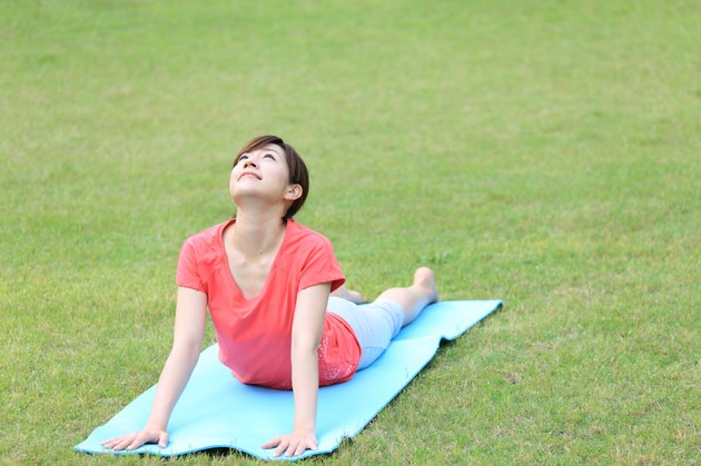 Japanese woman doing yoga Cobra Pose