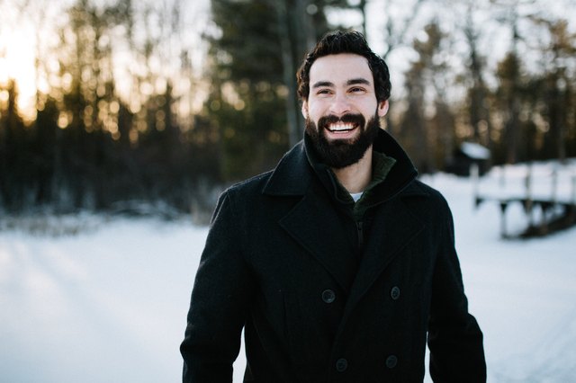 man with glowing skin hanging out outdoors