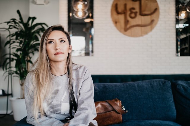 woman waiting on a couch