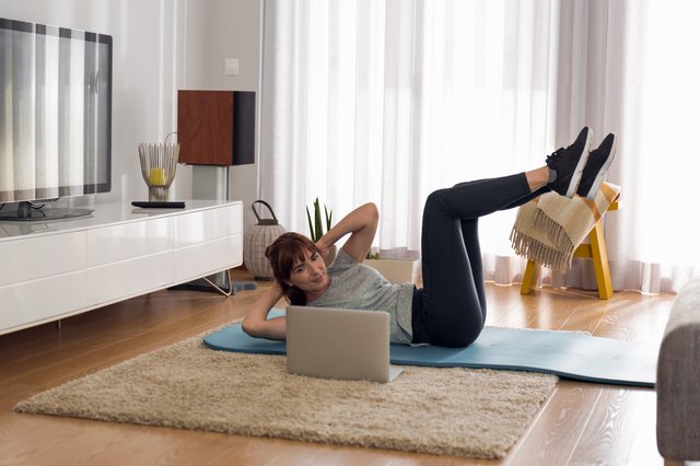 Woman doing video workout at home