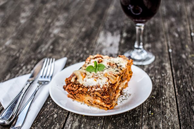 baked lasagna with cheese and fresh basil