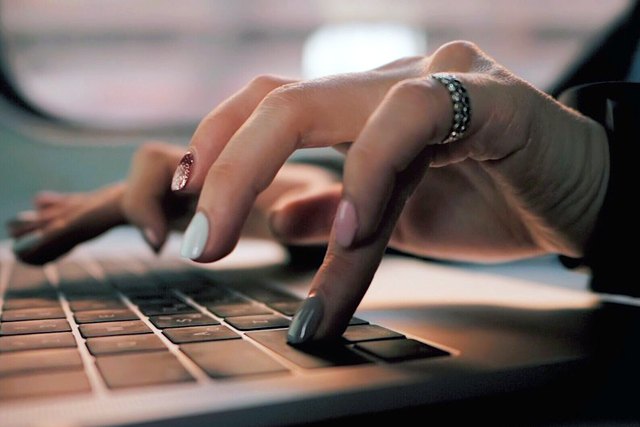woman doing work at computer