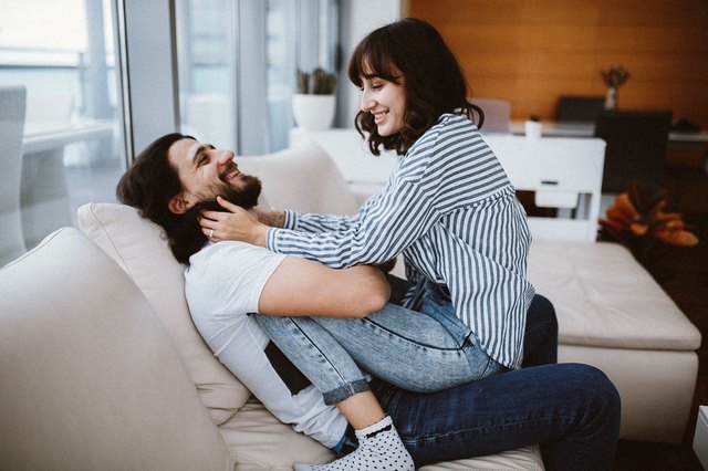 couple cuddling on the couch