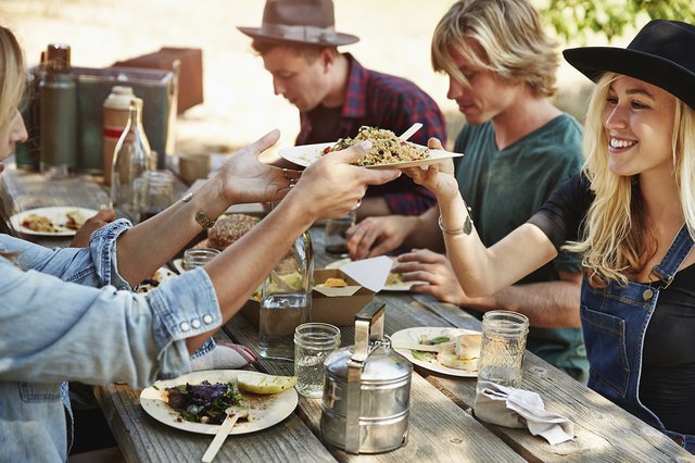 friends eating outside in summer
