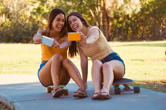 girls taking selfies