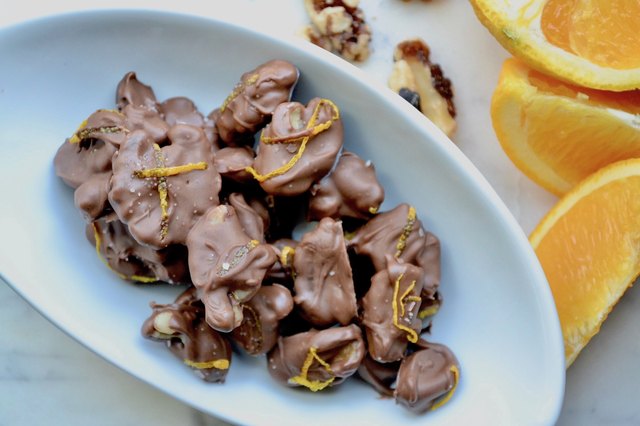 Chocolate Orange Salted Walnuts on a marble tabletop