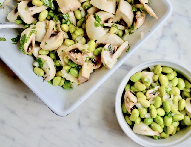 Edamame and Mushroom Salad on a marble tabletop