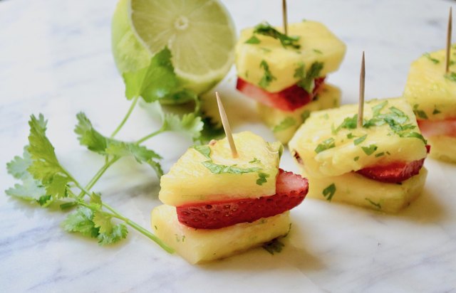 Cilantro Lime Marinated Pineapple Stackers on a marble tabletop