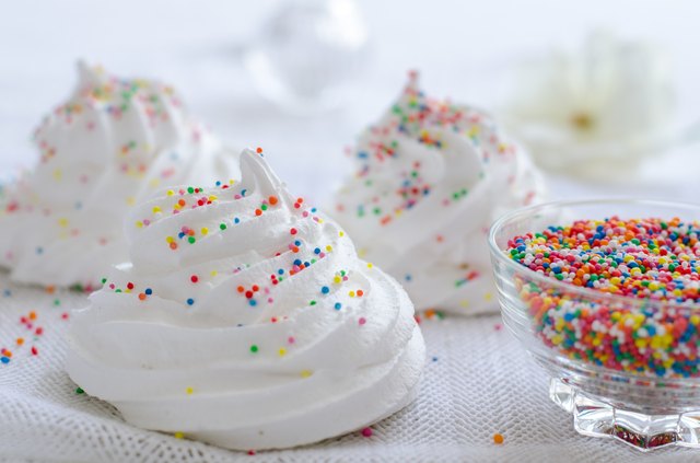 Meringues on cloth with sprinkles