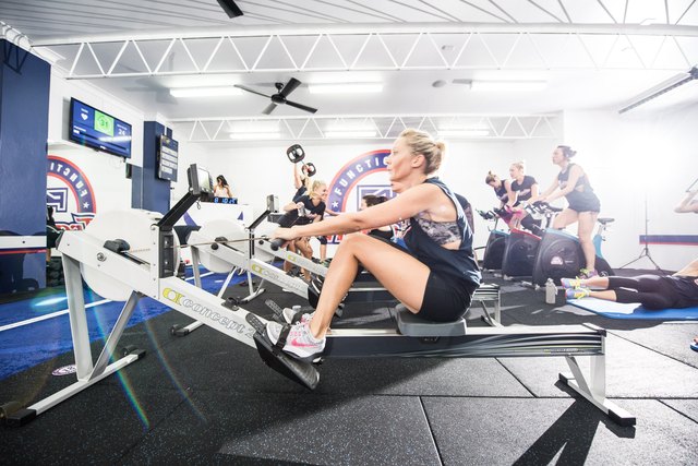 woman on a rowing machine during an F45 Training Class