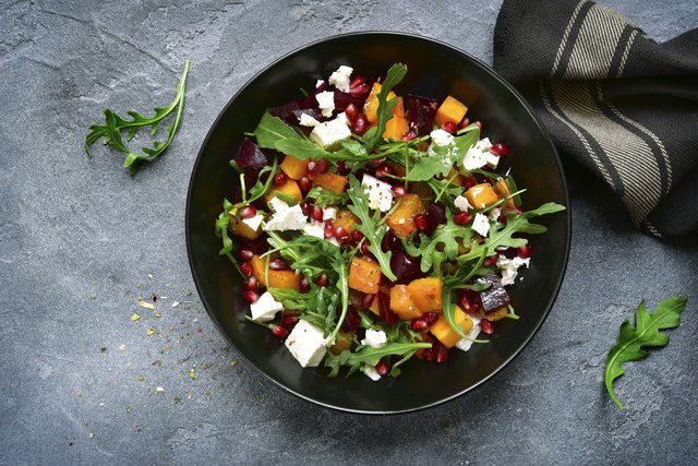 A plate filled with fresh fruits and vegetables